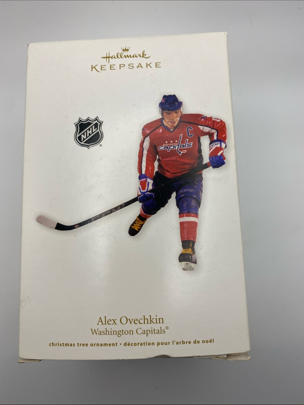 Hallmark Keepsake Red and Blue Hockey Player Ornament handcrafted – dated 2011